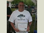 Matt Brennan displays his award for finishing 2nd Place in overall weight for the Pro Class (27 lb, 8 oz).