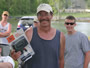 Angler Bill Markle displays a spotlight won during the prize raffle.