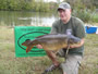 Val Grimley displays an 18 lb, 15 oz Common.