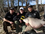 (from left) Mihai Aciu, Jason Bernhardt and Bogdan Bucur celebrate the catch and release of the record-setting Buffalo Bob. Lake Fork, TX