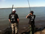 Paul Dinea (left) looks on as Ioan Iacob (right) plays a smallmouth buffalo during the 2012 Lake Fork Carp & Buffalo Challenge. Lake Fork, TX