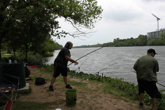 Phoenix Van Auken reeling in his catch during Session 4 f the Wild Carp Club of Austin Phoenix Van Auken reeling in his catch during Session 4 f the Wild Carp Club of Austin