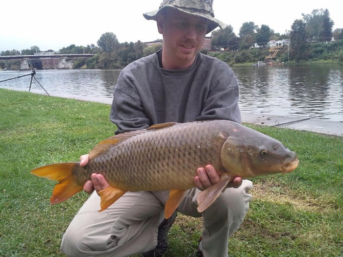 Jon Rasmussen with a 9.4 lb common caught during session 6. That's John's 1st fish as a member of the Wild Carp club of Central NY.