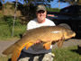 Jason Bernhardt with a 22.3 lb common caught during Session 1 of the Fall '12 season.