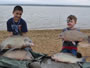 Ricky Wilson III (left) and Kaden Jaramillo posing with quadruple smallmouth buffalo caught during Session 1 of the 2013 season of the Wild Carp Club of North Texas.