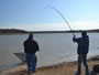 Club Director Rick Wilson (left) assists Marty Rosen (right) land his smallmouth buffalo during Session 1 of the Wild Carp Club of North Texas.