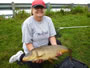 Linda Brin with an 11.0 lb common carp caught during Session 4 of the WIld Carp Club of Quebec.