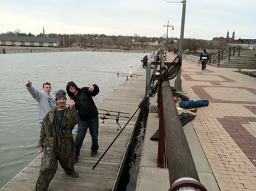 (From left) Sean Lehrer, Paul Russell and Matt Broekhuizen make the best of a slow night at the Syracuse Inner Harbor.