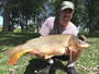 Kent Appleby displays a 17.8 lb common with an abnormal growth on its head.