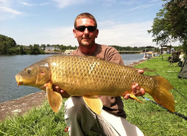 Chris West with a 16 lb, 3 oz common carp caught during the August 13, 2011 Shootout in Fulton, NY
