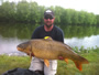 Dan Kelsey of NY poses with a 39 lb, 13 oz common carp caught during the 2012 Wild Carp Classic tournament in Baldwinsville, NY