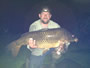 Robert Duprey with a 27.5 lb common caught during the 2012 Wild Carp Classic.