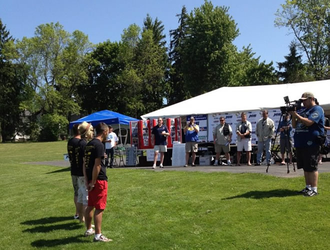 Tournament Director Jason Bernhardt introduces cmpetitrs Wade Live and Ivan Petrov during the 2012 JGB Celebrity Carp Challenge.