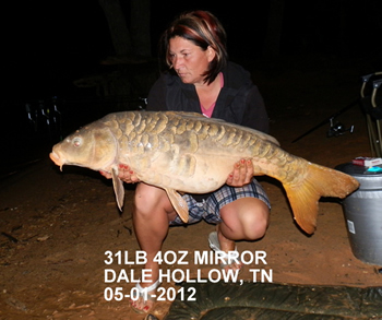 Director Christine Stout with a 31+ lb mirror carp caught in Dale Hollow, TN