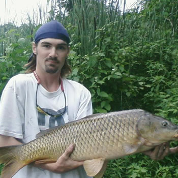 WCC of Ontario Director Brian Brown with a common carp caught in Ontario, Canada