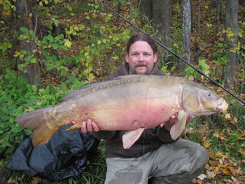 WCC of New England Director Robert Duprey with a 30+ lb mirror carp with full Fall color