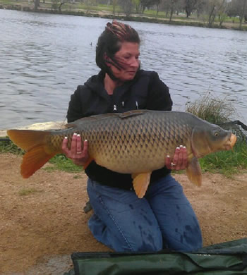 Wild Carp Club of Indiana Director Christine Stout with a common carp
