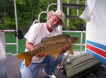 Wild Carp Club of Indiana Director Gilbert Huxley with another nice mirror carp caught at Dale Hollow Lake in TN