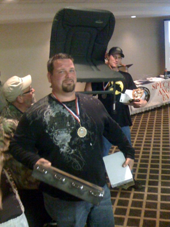 Wild Carp Club of North Texas Director Rick Wilson with his medal and prizes won during the 2012 Austin Team Championship